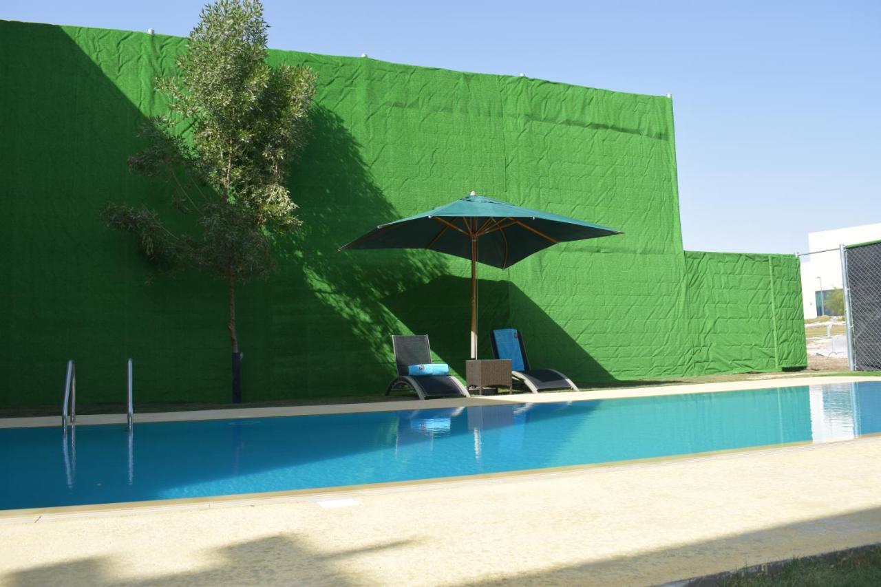 เรทาจ ซัลวา รีสอร์ต แอนด์ สปา Hotel Al Rayyan ภายนอก รูปภาพ A swimming pool in Spain