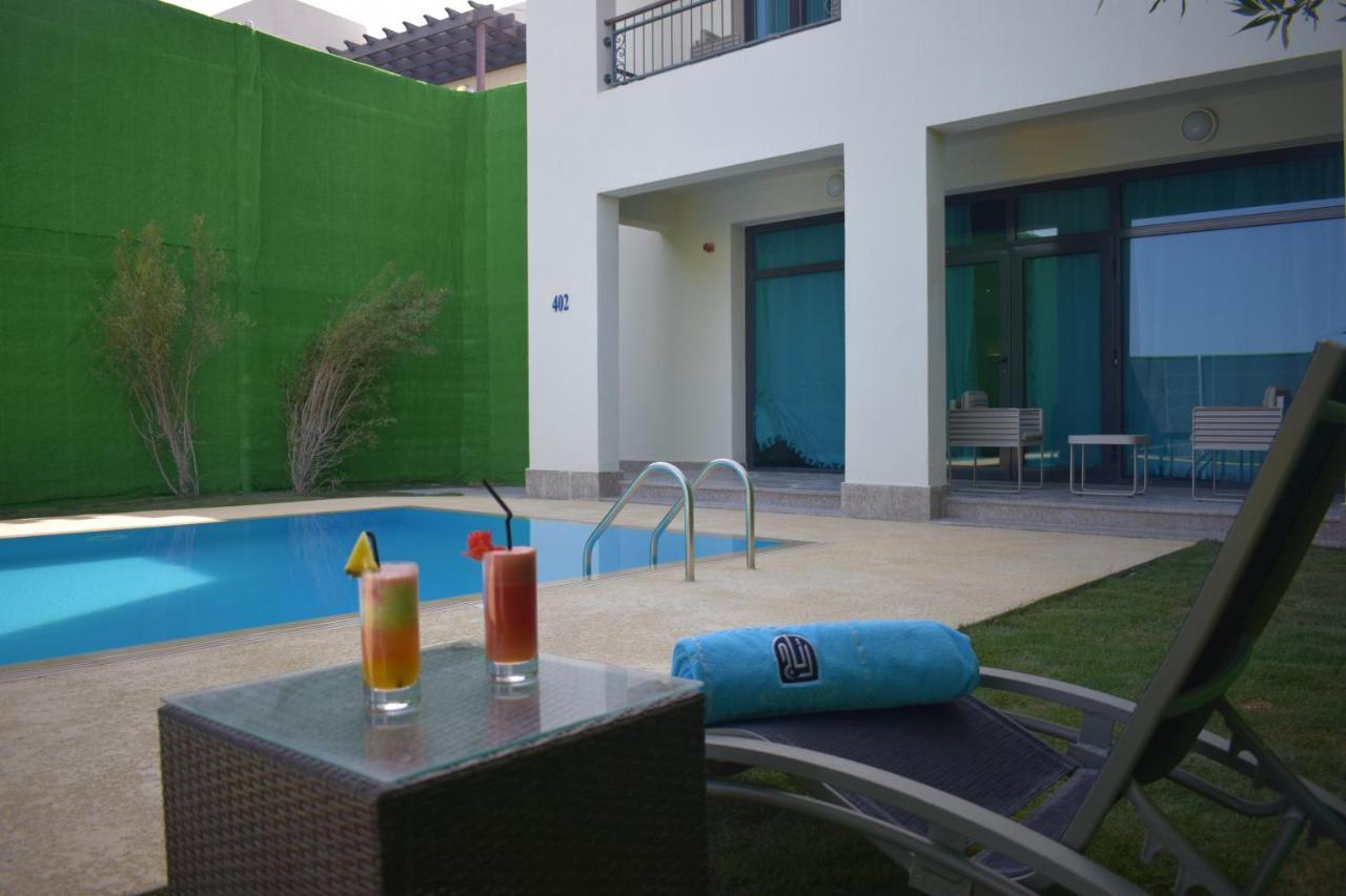 เรทาจ ซัลวา รีสอร์ต แอนด์ สปา Hotel โดฮา ภายนอก รูปภาพ The swimming pool at the hotel