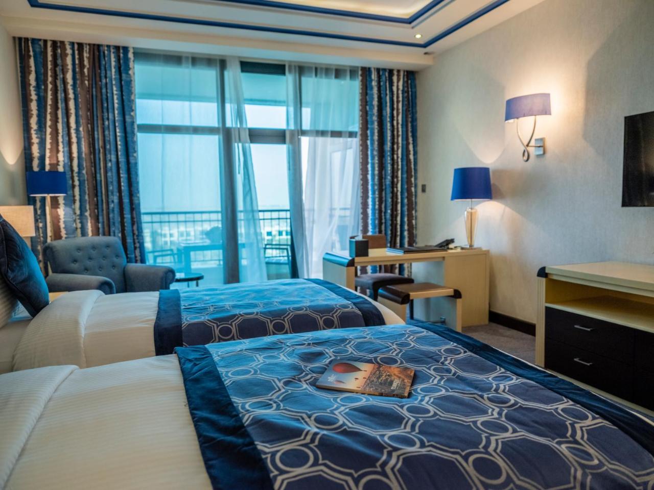 เรทาจ ซัลวา รีสอร์ต แอนด์ สปา Hotel โดฮา ภายนอก รูปภาพ A room at the hotel